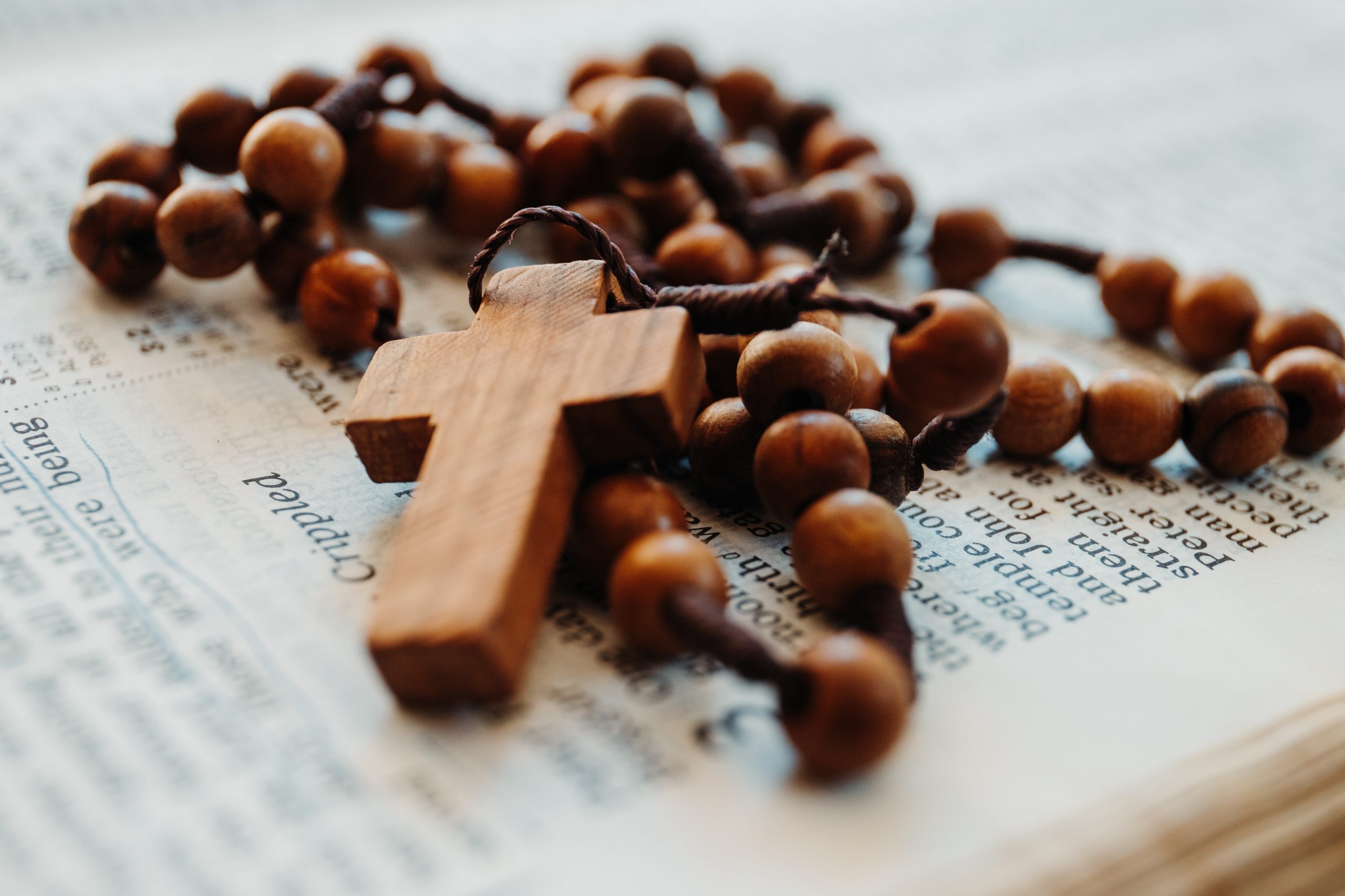 Catholics Against Circumcision cross and rosary beads